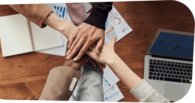 Hands joined together symbolizing teamwork