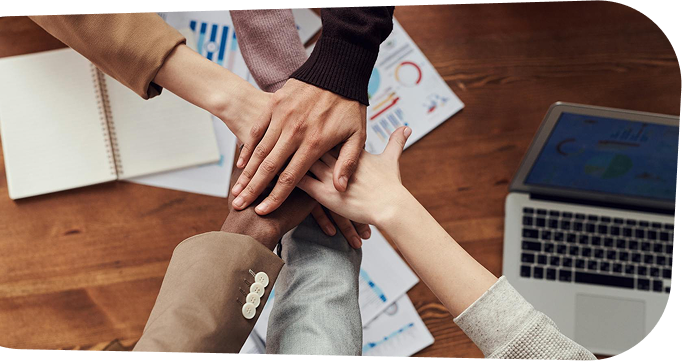 Hands joined together symbolizing teamwork
