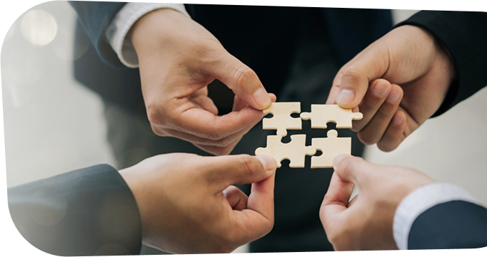 Team collaboration representing unity with puzzle pieces